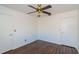 Simple bedroom with dark brown wood flooring and ceiling fan at 824 Park Lake Pl # 824, Maitland, FL 32751