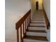Indoor staircase with wooden railing leading to the second floor at 824 Park Lake Pl # 824, Maitland, FL 32751