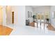 Gathering room with hardwood floors, glass doors, and pool access at 840 Coach Lamp Ct, Sanford, FL 32771