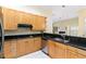 Modern kitchen with light wood cabinets, granite countertops and stainless steel appliances at 840 Coach Lamp Ct, Sanford, FL 32771