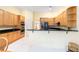 Kitchen boasts light wood cabinets, granite countertops, and stainless steel appliances at 840 Coach Lamp Ct, Sanford, FL 32771