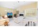 Living room features a fireplace, built-in shelving, and large windows at 840 Coach Lamp Ct, Sanford, FL 32771