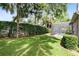 Spacious backyard with lush lawn, hedges and screened pool at 840 Coach Lamp Ct, Sanford, FL 32771