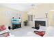 Living room with fireplace, built-in shelving, and a view into the kitchen at 840 Coach Lamp Ct, Sanford, FL 32771