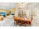 Bright breakfast nook with wood table and chairs, overlooking the living room at 840 Coach Lamp Ct, Sanford, FL 32771