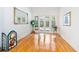 Gathering room with hardwood floors, glass doors, and pool access at 840 Coach Lamp Ct, Sanford, FL 32771