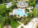 Aerial view of community pool, clubhouse, and playground at 840 Coach Lamp Ct, Sanford, FL 32771