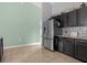 Kitchen features stainless steel refrigerator and dark brown cabinets at 617 Brockton Dr, Kissimmee, FL 34758