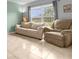 Living room with tiled floors and comfortable seating at 617 Brockton Dr, Kissimmee, FL 34758