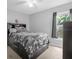 Well-lit bedroom with a window and built-in drawers at 617 Brockton Dr, Kissimmee, FL 34758