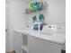Laundry room with washer, dryer, and storage shelves at 617 Brockton Dr, Kissimmee, FL 34758