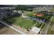 Aerial view of community showing sports fields and park at 617 Brockton Dr, Kissimmee, FL 34758