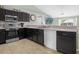 Modern kitchen with stainless steel appliances and a breakfast bar at 617 Brockton Dr, Kissimmee, FL 34758