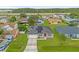 Aerial view of a house with solar panels, showcasing its curb appeal and neighborhood setting at 617 Brockton Dr, Kissimmee, FL 34758