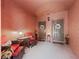 Inviting entryway with comfortable seating, wreaths, and soft lighting at 1001 Via Capri Ln # 204, Celebration, FL 34747