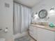 Updated bathroom with tub, shower, vanity, and decorative accents at 1001 Via Capri Ln # 204, Celebration, FL 34747