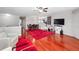 Spacious living area with hardwood floors and red rug at 1001 Via Capri Ln # 204, Celebration, FL 34747