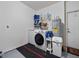 Convenient laundry room with washer, dryer, and storage shelving at 1001 Via Capri Ln # 204, Celebration, FL 34747