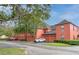 Rear view of building showcasing garages and well-maintained grounds at 1001 Via Capri Ln # 204, Celebration, FL 34747