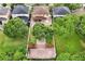 Aerial view of house and backyard, showing the large tree and surrounding homes at 10233 Serotina Ct, Orlando, FL 32832