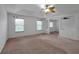 Spacious bedroom with neutral carpeting and ceiling fan at 10233 Serotina Ct, Orlando, FL 32832