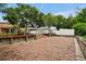 Large brick patio with wooden retaining walls and landscaping at 10233 Serotina Ct, Orlando, FL 32832