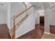 Staircase with wooden handrail and hardwood flooring below at 10233 Serotina Ct, Orlando, FL 32832