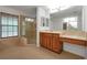 Bathroom with walk-in shower, double vanity, and tiled flooring at 10233 Serotina Ct, Orlando, FL 32832