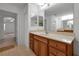 Bathroom with double sinks, vanity, and a shower at 10233 Serotina Ct, Orlando, FL 32832