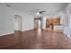 Spacious living area with herringbone flooring and access to the kitchen at 10233 Serotina Ct, Orlando, FL 32832