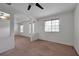 Main bedroom with carpeted floor and two windows with blinds at 10233 Serotina Ct, Orlando, FL 32832
