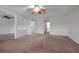 Spacious main bedroom with carpeted floors and ceiling fan at 10233 Serotina Ct, Orlando, FL 32832