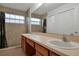 Large bathroom with double sinks and shower at 10233 Serotina Ct, Orlando, FL 32832