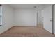 Bedroom with carpet, window, and access to upper floor at 10233 Serotina Ct, Orlando, FL 32832