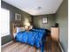 Two twin beds in a well-lit bedroom with wood-look floors at 1821 Morning Star Dr, Clermont, FL 34714