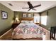 King-size bed in a spacious bedroom with ceiling fan at 1821 Morning Star Dr, Clermont, FL 34714