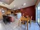 Kitchen features breakfast nook, island with seating, and ample cabinet space at 1821 Morning Star Dr, Clermont, FL 34714
