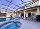 Covered patio with pool, spa, and seating at 1821 Morning Star Dr, Clermont, FL 34714