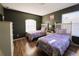 Two twin beds with unicorn bedding in a bright bedroom at 1821 Morning Star Dr, Clermont, FL 34714