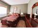 Bedroom with a queen bed and dark wood furniture at 1821 Morning Star Dr, Clermont, FL 34714