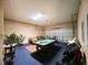 Finished game room with pool table, foosball, and seating at 1821 Morning Star Dr, Clermont, FL 34714