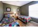 Two twin beds with colorful bedding in a bedroom at 1821 Morning Star Dr, Clermont, FL 34714