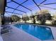 Screened pool and spa with lounge chairs at 1821 Morning Star Dr, Clermont, FL 34714