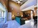 Relaxing living room with sectional sofa, access to patio, and high ceilings at 1821 Morning Star Dr, Clermont, FL 34714