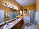 Bathroom boasts double vanity, soaking tub, and walk-in shower at 1821 Morning Star Dr, Clermont, FL 34714