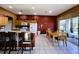 Eat-in kitchen with island, ample counter space, and view of the backyard at 1821 Morning Star Dr, Clermont, FL 34714