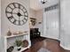 Bright and airy entryway with a large clock and welcoming decor at 22428 E Colonial Dr, Christmas, FL 32709