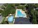 Community pool and playground with surrounding trees at 3260 Marshfield Preserve Way, Kissimmee, FL 34746
