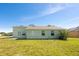 House exterior with grassy backyard at 3260 Marshfield Preserve Way, Kissimmee, FL 34746