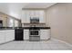 Modern kitchen features stainless steel range and microwave at 3260 Marshfield Preserve Way, Kissimmee, FL 34746